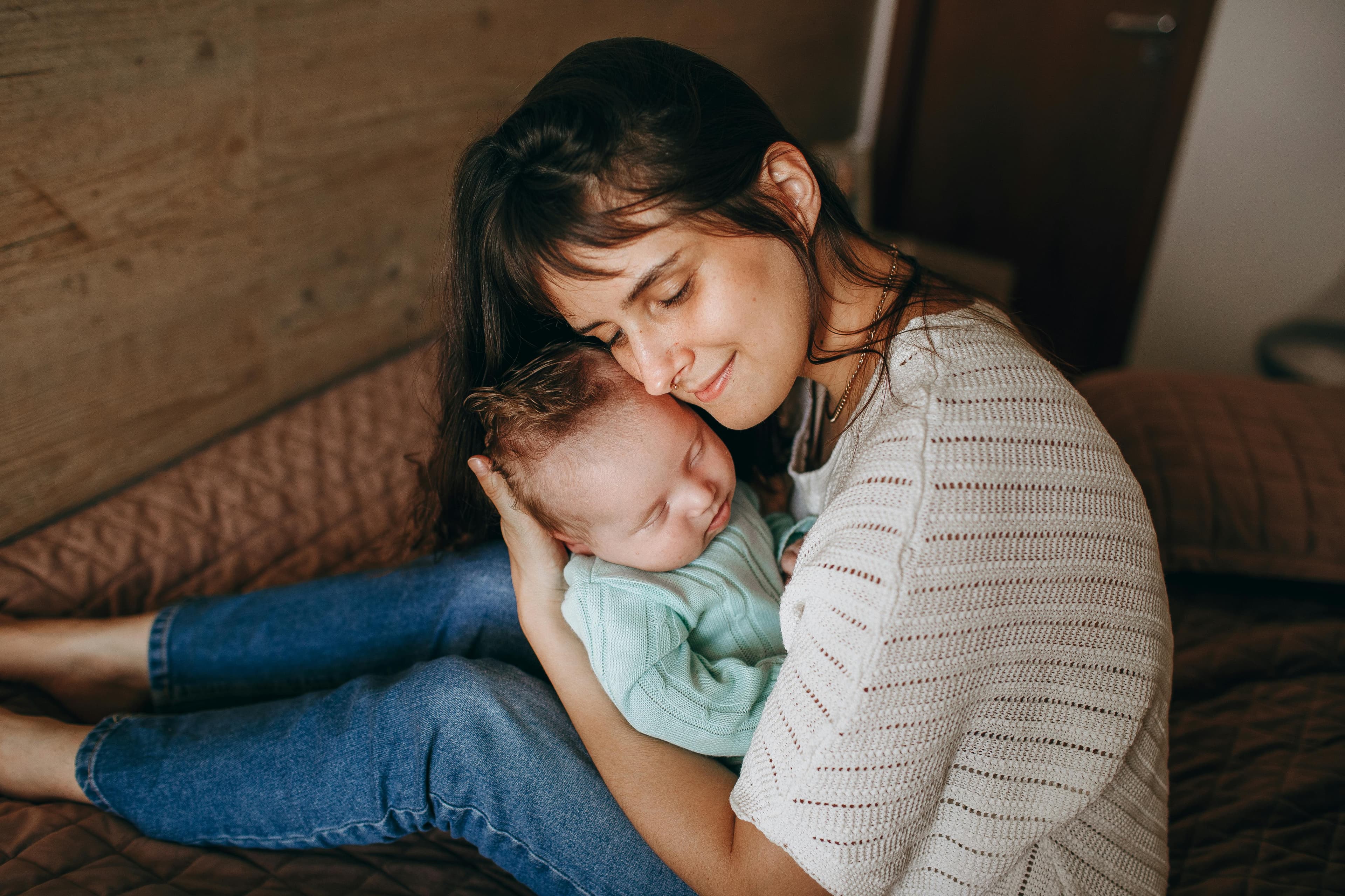 mom hugging baby