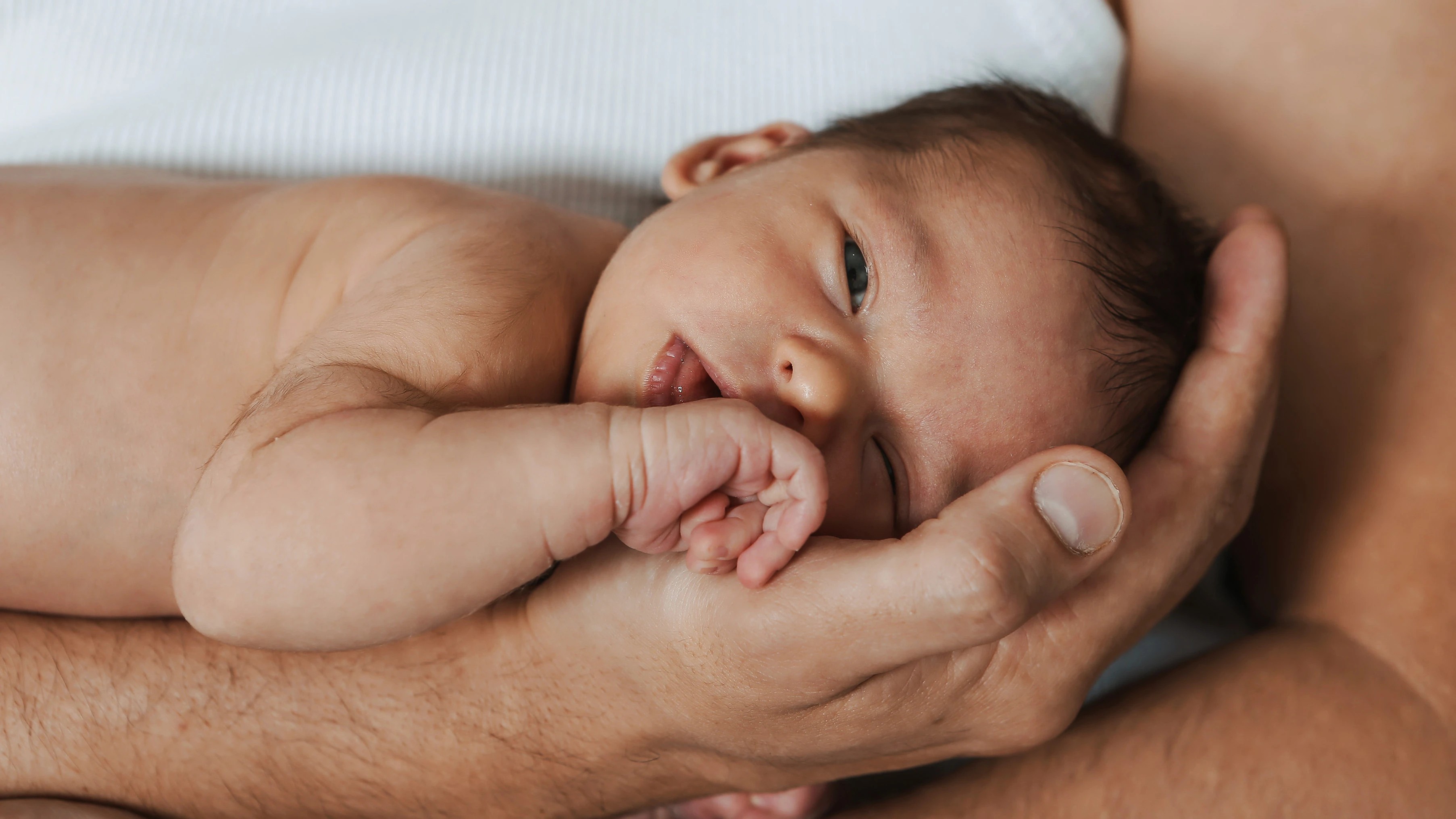 Colic hold: A newborn on their dads arm